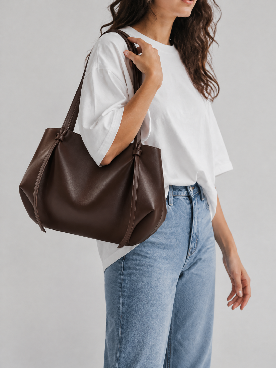 Slouchy Vegan Leather Tote Bag | Potsdam — dark brown tote styled with a white T-shirt