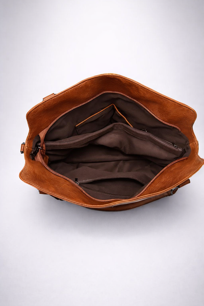 Brown leather bag on a white background