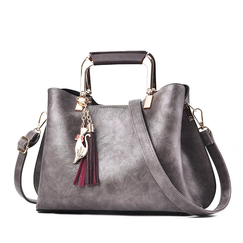 Metal Handle Tassel Satchel | Seville