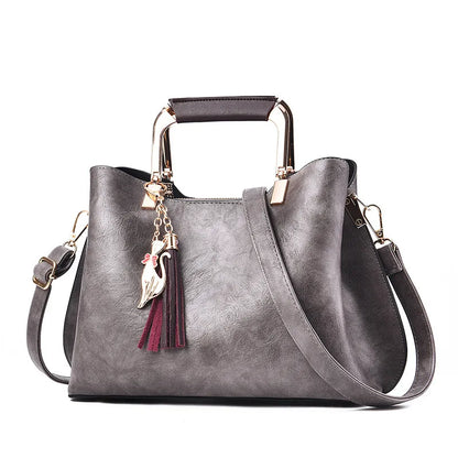 Metal Handle Tassel Satchel | Seville