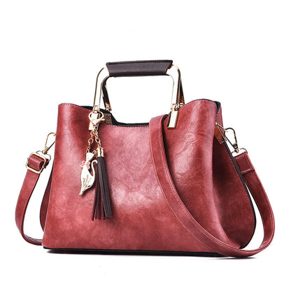 Metal Handle Tassel Satchel | Seville