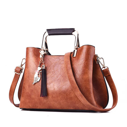 Metal Handle Tassel Satchel | Seville