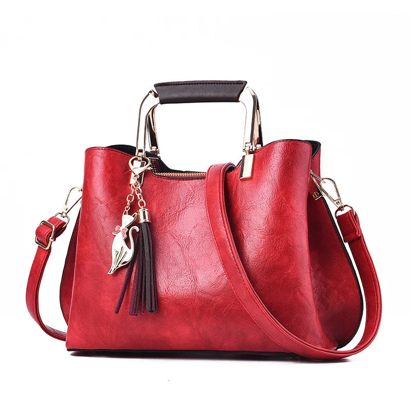 Metal Handle Tassel Satchel | Seville