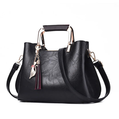 Metal Handle Tassel Satchel | Seville